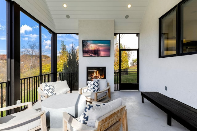 sunroom / solarium with lofted ceiling