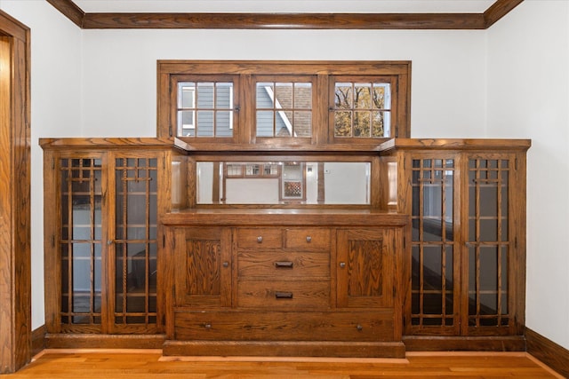 details featuring crown molding and hardwood / wood-style flooring