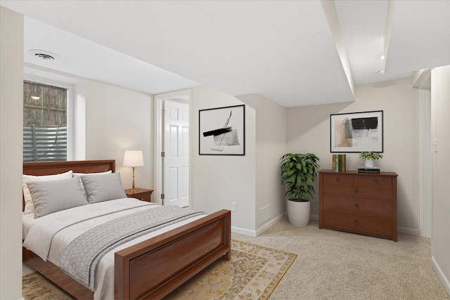 bedroom featuring light colored carpet