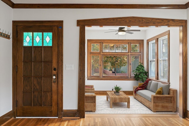 foyer with light hardwood / wood-style floors, plenty of natural light, and ceiling fan