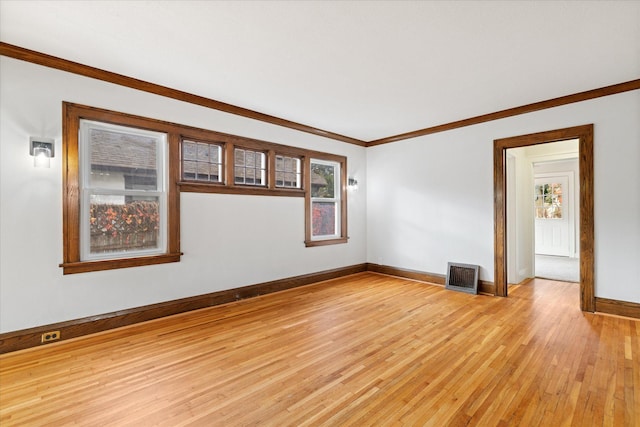 unfurnished room with ornamental molding, light hardwood / wood-style flooring, and plenty of natural light