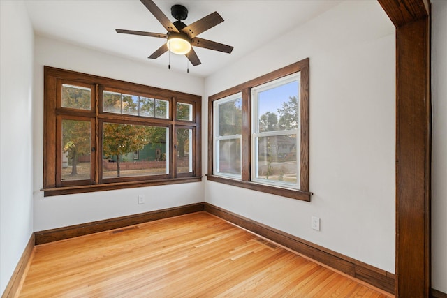 empty room featuring hardwood / wood-style floors and ceiling fan