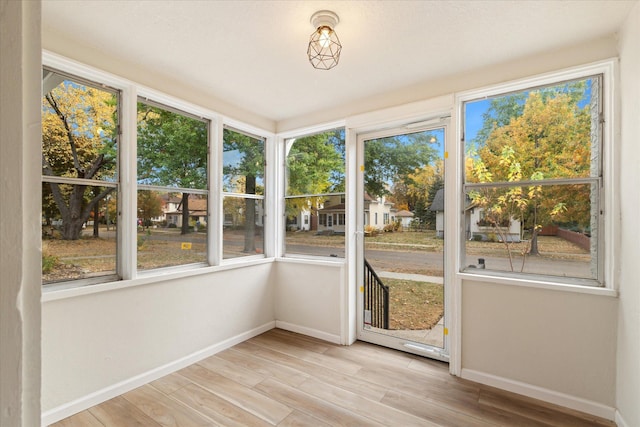 unfurnished sunroom featuring plenty of natural light