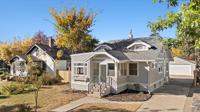 view of front of home with a front yard and a garage