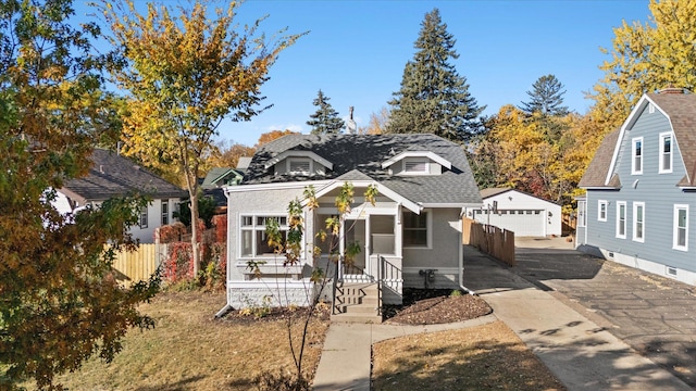 view of front of home featuring an outdoor structure and a garage