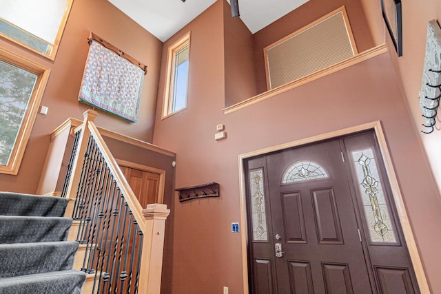 entryway with a high ceiling