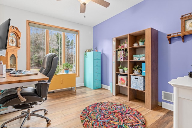 office with ceiling fan and light wood-type flooring