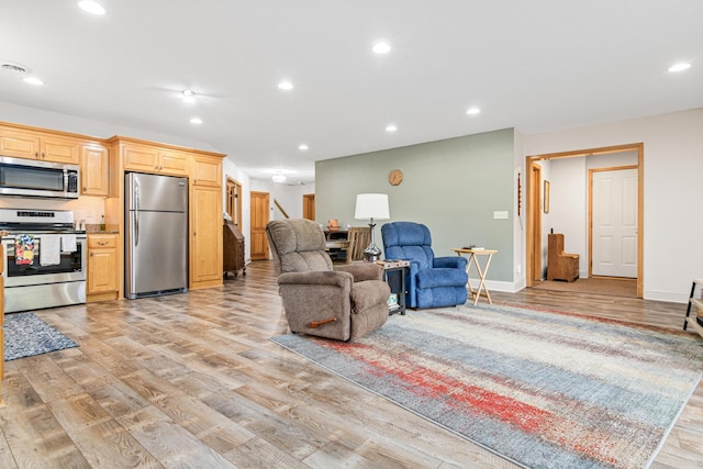 living room with light hardwood / wood-style floors