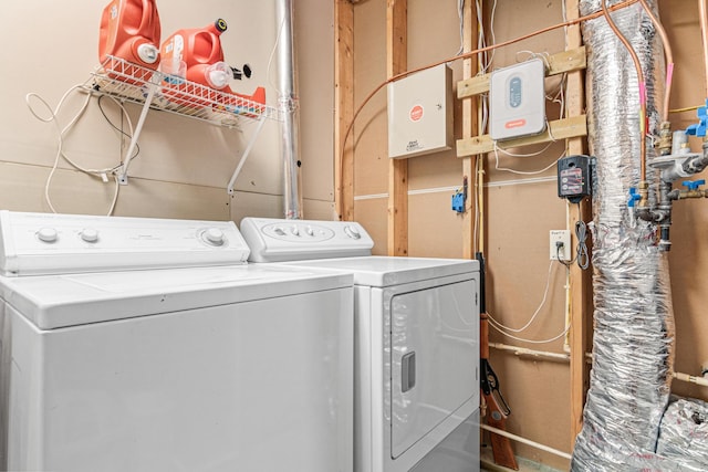 clothes washing area with independent washer and dryer