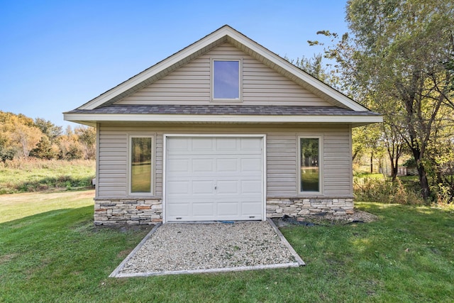 garage with a yard