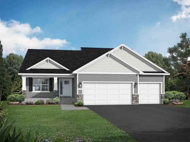 craftsman house with a front yard and a garage