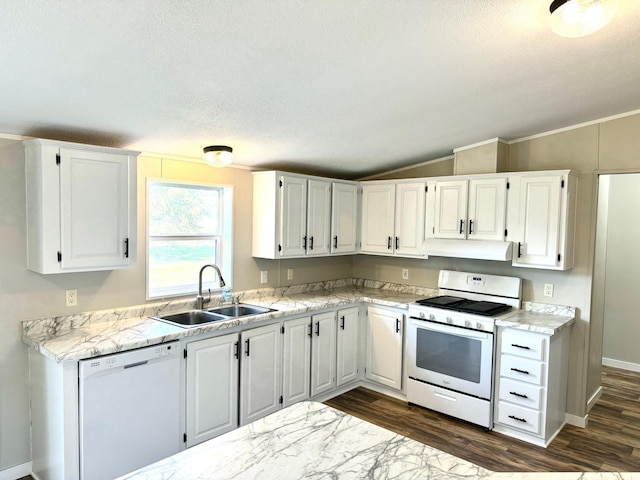 kitchen featuring lofted ceiling, dark hardwood / wood-style flooring, white cabinetry, sink, and white appliances