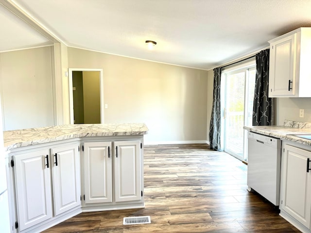 kitchen with white cabinetry, lofted ceiling, and dishwasher