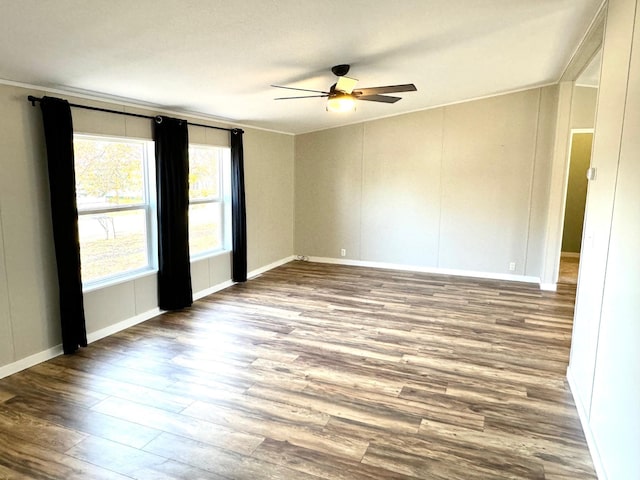 unfurnished room with ceiling fan, crown molding, and hardwood / wood-style floors