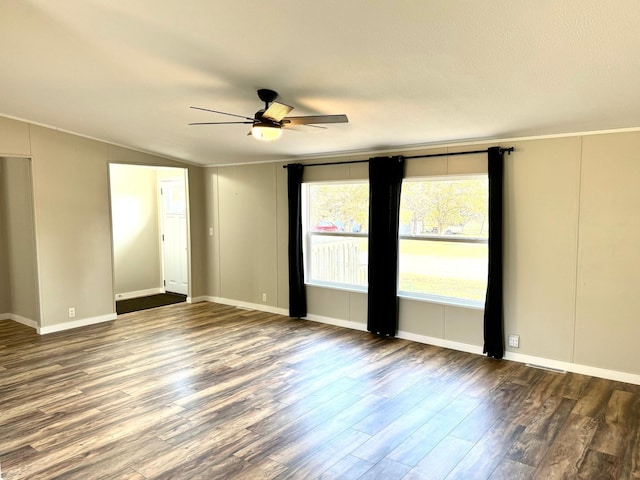 spare room featuring ceiling fan, crown molding, wood-type flooring, and lofted ceiling