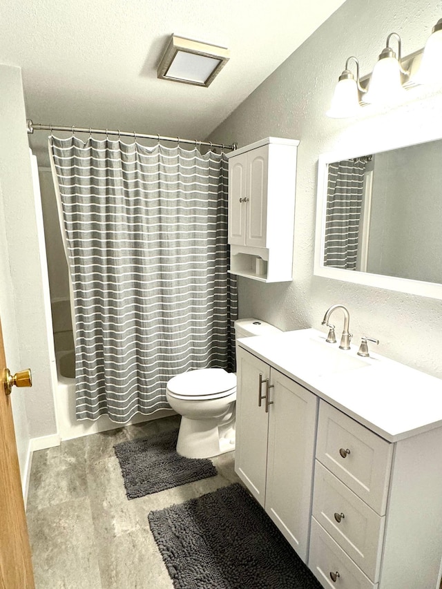 full bathroom with toilet, shower / tub combo, vaulted ceiling, vanity, and a textured ceiling