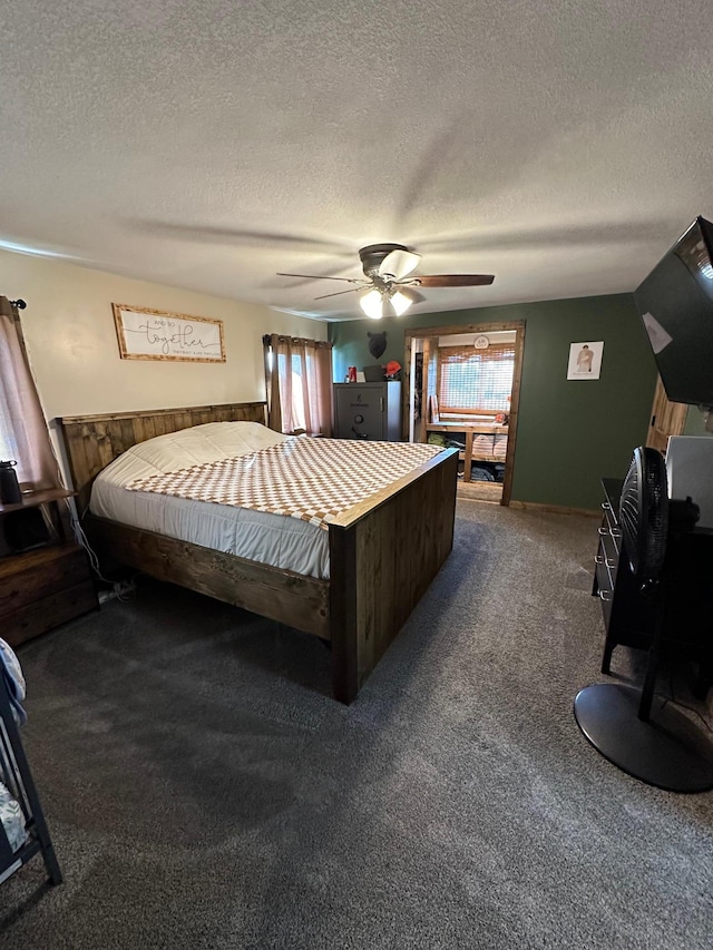 carpeted bedroom featuring a textured ceiling and ceiling fan