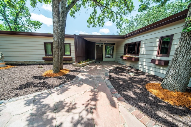 1425 20th St SW, Rochester, MN 55902 - doorway to property featuring a patio