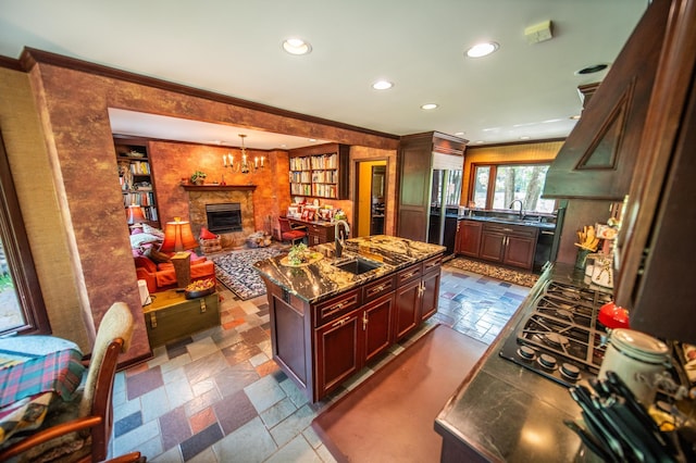 1425 20th St SW, Rochester, MN 55902 - kitchen featuring black appliances, a fireplace, recessed lighting, an island with sink, and crown molding