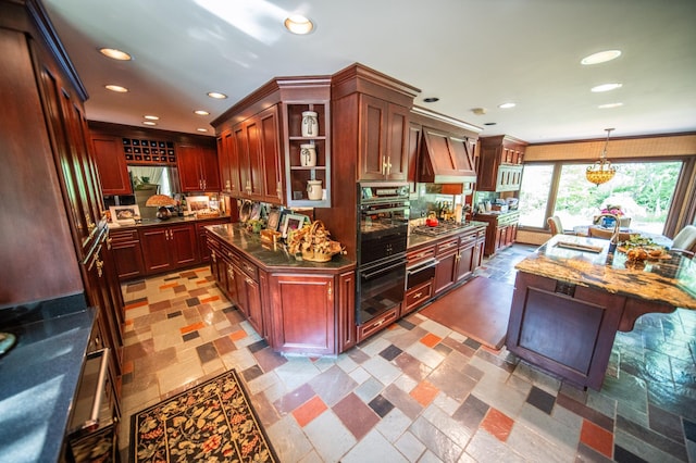 1425 20th St SW, Rochester, MN 55902 - kitchen with stainless steel gas stovetop, open shelves, recessed lighting, pendant lighting, and custom exhaust hood