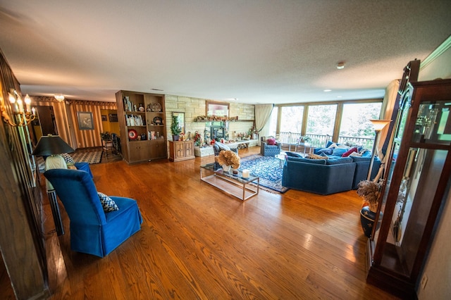 1425 20th St SW, Rochester, MN 55902 - living area with wood finished floors, a fireplace, and a chandelier