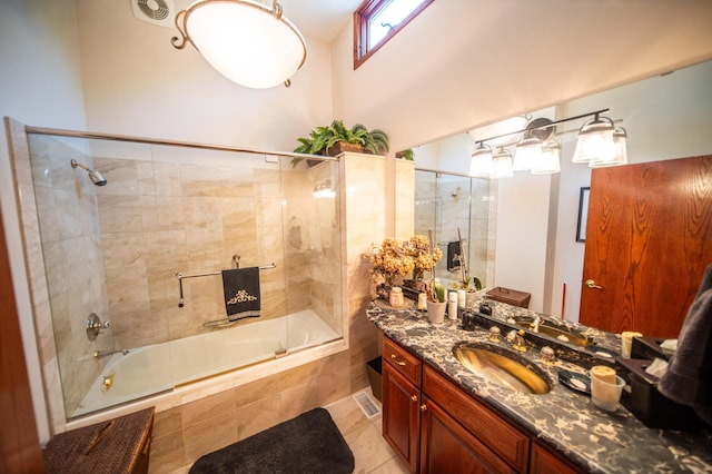 1425 20th St SW, Rochester, MN 55902 - bathroom featuring tiled shower / bath, vanity, and tile patterned floors