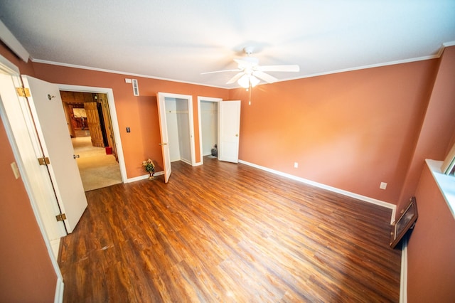 1425 20th St SW, Rochester, MN 55902 - unfurnished bedroom with wood finished floors, crown molding, and a ceiling fan