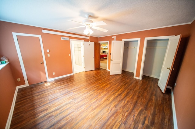 1425 20th St SW, Rochester, MN 55902 - unfurnished bedroom featuring multiple closets, crown molding, wood finished floors, a textured ceiling, and ceiling fan