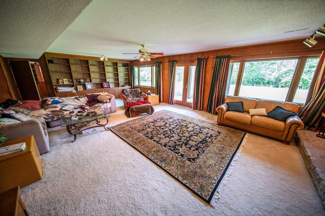 1425 20th St SW, Rochester, MN 55902 - carpeted living room with a textured ceiling and ceiling fan