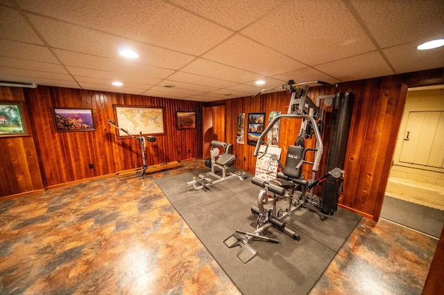 1425 20th St SW, Rochester, MN 55902 - exercise room with a paneled ceiling, wood walls, and recessed lighting