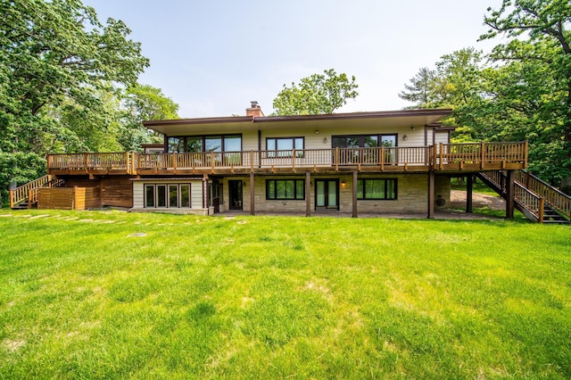 1425 20th St SW, Rochester, MN 55902 - rear view of house with stairway, a deck, a chimney, and a lawn