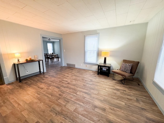 unfurnished room with wood-type flooring