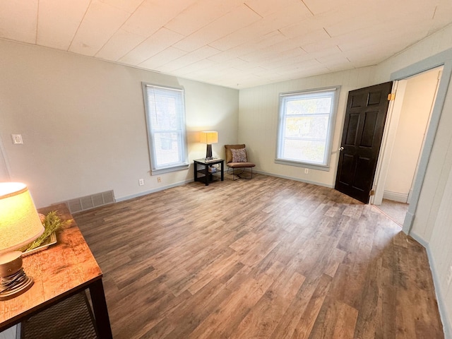 living area with dark hardwood / wood-style floors