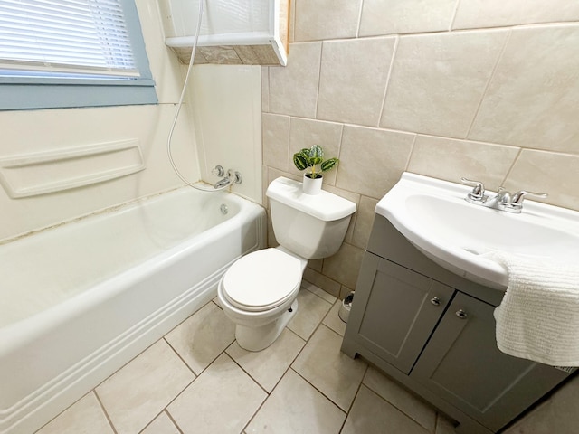 full bathroom with toilet, shower / bath combination, tile patterned flooring, vanity, and tile walls