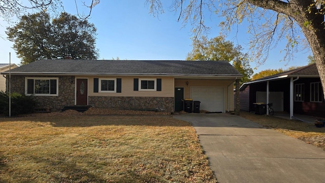 view of front of home with a front yard, a garage, and a carport