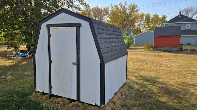 view of outdoor structure with a lawn