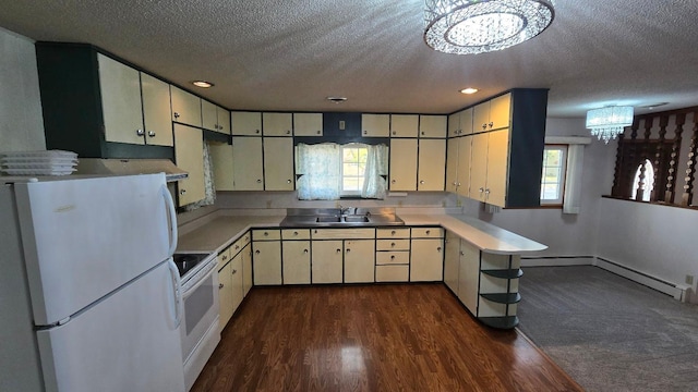 kitchen with an inviting chandelier, dark wood-type flooring, a textured ceiling, and white appliances