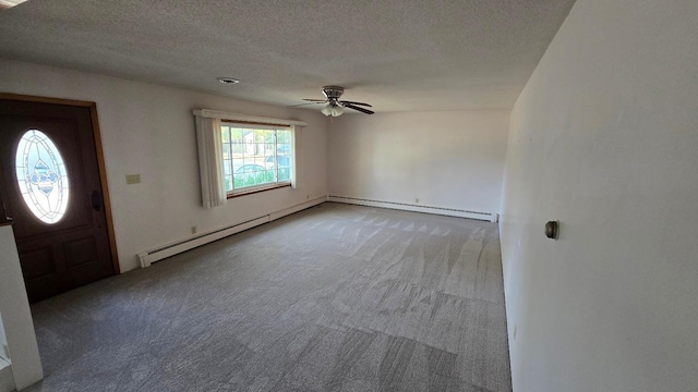 carpeted entrance foyer featuring a textured ceiling, a baseboard radiator, and ceiling fan