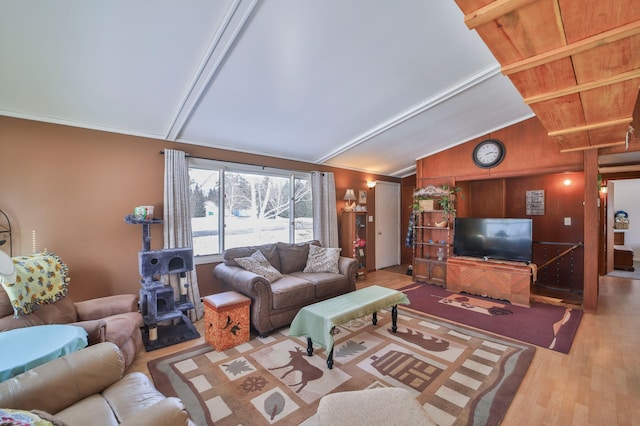 living room featuring lofted ceiling and wood finished floors