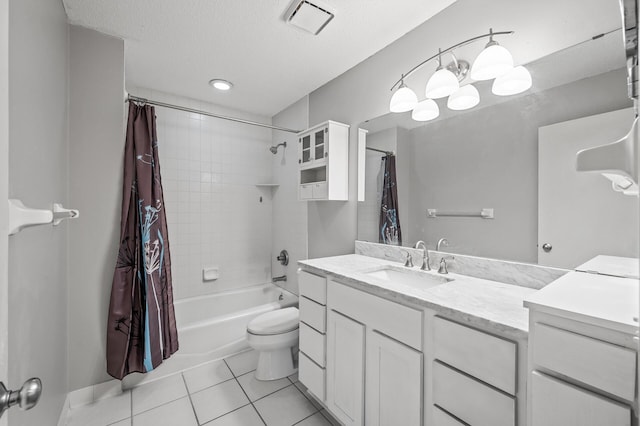 full bathroom with vanity, shower / tub combo, toilet, tile patterned floors, and a textured ceiling