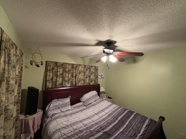 unfurnished bedroom featuring a textured ceiling and ceiling fan