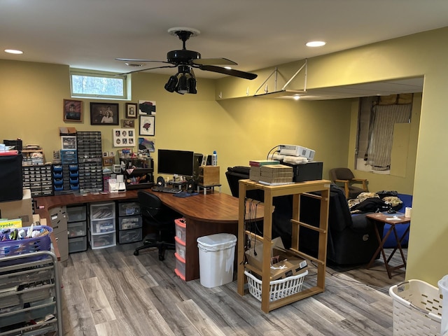 home office featuring wood-type flooring and ceiling fan