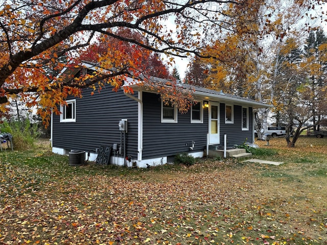 view of front of property featuring central air condition unit