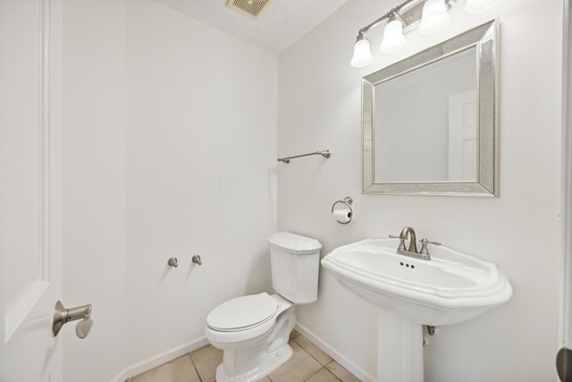 bathroom with tile patterned floors and toilet