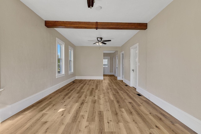 unfurnished living room featuring light hardwood / wood-style floors, beamed ceiling, and ceiling fan