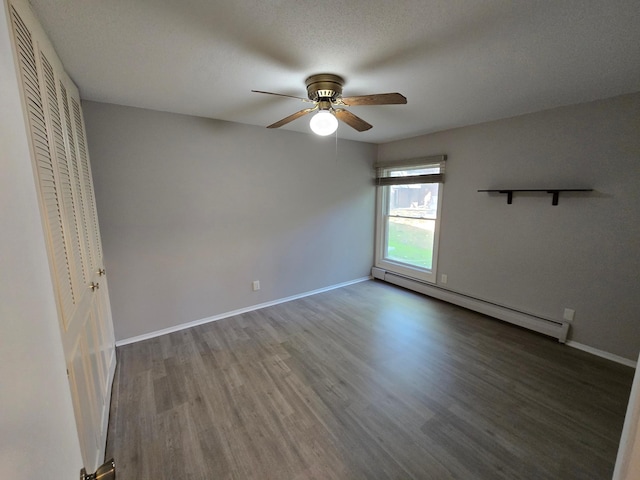 unfurnished bedroom with a textured ceiling, hardwood / wood-style flooring, a baseboard radiator, and ceiling fan