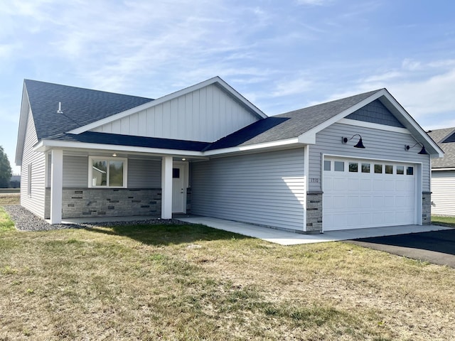 view of front facade featuring a garage and a front lawn