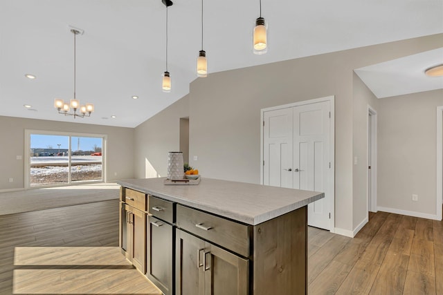1710 Maple Leaf Ln, Litchfield, MN 55355 - kitchen with light wood finished floors, vaulted ceiling, and baseboards