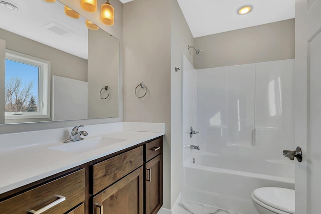 full bathroom featuring vanity, toilet, and bathtub / shower combination