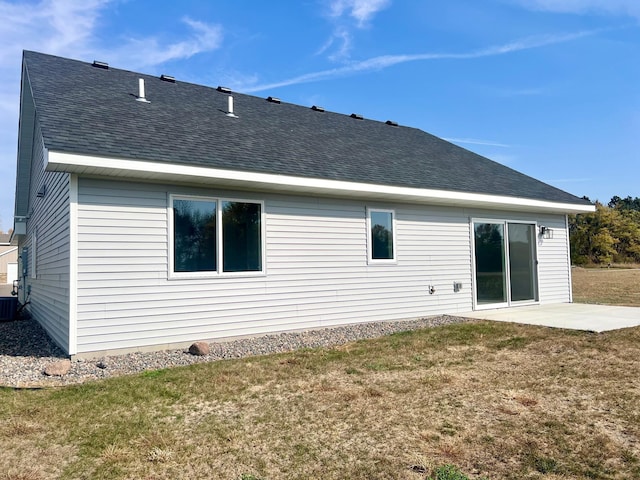 rear view of house with a patio area and a yard